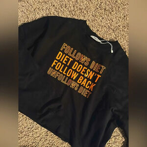 Cropped black sweatshirt with neon saying on it